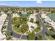 Panoramic aerial view of the community showcasing well-manicured lawns, mature trees, and tennis courts at 7832 E Via Marina --, Scottsdale, AZ 85258