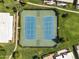 Aerial shot featuring fenced tennis courts surrounded by well-manicured lawns and landscaped grounds at 7832 E Via Marina --, Scottsdale, AZ 85258