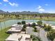 Stunning aerial view of homes surrounding a tranquil lake and lush golf course with mountain views at 7832 E Via Marina --, Scottsdale, AZ 85258