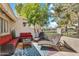 Relaxing outdoor patio with lounge chairs and comfortable seating, shaded by lush greenery at 7832 E Via Marina --, Scottsdale, AZ 85258