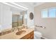 Well-lit bathroom with tile countertop, shower and neutral wall color at 7832 E Via Marina --, Scottsdale, AZ 85258
