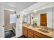Elegant bathroom with double sinks, a large mirror, and a bathtub for a spa-like experience at 7832 E Via Marina --, Scottsdale, AZ 85258