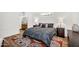 Inviting bedroom with a plush gray bed, stylish rug, and lamps, creating a cozy and relaxing space at 7832 E Via Marina --, Scottsdale, AZ 85258
