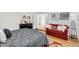 Cozy bedroom featuring a comfortable gray bed, a red sofa, and natural light for a welcoming space at 7832 E Via Marina --, Scottsdale, AZ 85258