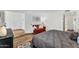 Cozy bedroom featuring a comfortable bed, red sofa, and ample natural light from the window at 7832 E Via Marina --, Scottsdale, AZ 85258