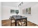 Elegant dining room with a dark wood table, stylish chairs, and natural light from the window at 7832 E Via Marina --, Scottsdale, AZ 85258