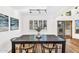 Bright dining room with a dark wood table, modern chairs, and sliding doors, perfect for Gathering meals at 7832 E Via Marina --, Scottsdale, AZ 85258