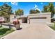 Inviting single-level home featuring a two-car garage, desert landscaping, and a stucco exterior at 7832 E Via Marina --, Scottsdale, AZ 85258