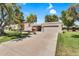 Charming single-story home with a two-car garage, mature trees, and a well-maintained front yard at 7832 E Via Marina --, Scottsdale, AZ 85258