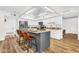 Well-equipped kitchen with stainless steel appliances, a gray island with seating, and white cabinetry at 7832 E Via Marina --, Scottsdale, AZ 85258