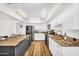 Bright kitchen featuring white cabinetry, gray island, and stainless steel appliances at 7832 E Via Marina --, Scottsdale, AZ 85258