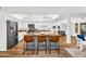 Stylish kitchen features an island with bar stools, modern appliances, and abundant natural light, perfect for cooking and gatherings at 7832 E Via Marina --, Scottsdale, AZ 85258