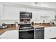 The kitchen offers white cabinets and modern appliances including a stainless microwave at 7832 E Via Marina --, Scottsdale, AZ 85258