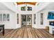 Bright open living area features vaulted wood ceilings, a sliding glass door, and wood-look floors at 7832 E Via Marina --, Scottsdale, AZ 85258