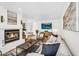 Comfortable living room with fireplace, wood floors, and an open layout at 7832 E Via Marina --, Scottsdale, AZ 85258