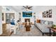 Open living room featuring a fireplace, TV, sliding glass doors and contemporary furnishings at 7832 E Via Marina --, Scottsdale, AZ 85258