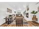 Spacious living room with wood floors, a fireplace, and a seamless flow to the dining area at 7832 E Via Marina --, Scottsdale, AZ 85258