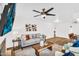 Cozy living room with a fireplace, TV, stylish decor, and plenty of seating at 7832 E Via Marina --, Scottsdale, AZ 85258