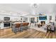 Spacious open-concept living room and kitchen with island seating, fireplace, and plenty of natural light at 7832 E Via Marina --, Scottsdale, AZ 85258