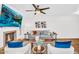 Spacious living room with a fireplace, TV, stylish decor, and plenty of seating at 7832 E Via Marina --, Scottsdale, AZ 85258