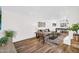 Open-concept living room featuring wood floors, comfortable seating, and lots of natural light at 7832 E Via Marina --, Scottsdale, AZ 85258