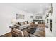 Bright living room with wood floors, modern furnishings, and an adjacent dining area at 7832 E Via Marina --, Scottsdale, AZ 85258