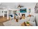 Open concept living room featuring a fireplace, TV, dining area and contemporary furnishings at 7832 E Via Marina --, Scottsdale, AZ 85258