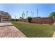 Lush backyard featuring a brick patio, well-maintained lawn, and mature landscaping at 8501 E Malcomb Dr, Scottsdale, AZ 85250