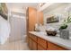 Bathroom featuring wood cabinets, a sink, and decor for a homey feel at 8501 E Malcomb Dr, Scottsdale, AZ 85250