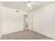 Bright bedroom featuring neutral walls, plush carpeting, and a ceiling fan at 8501 E Malcomb Dr, Scottsdale, AZ 85250
