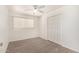 Cozy bedroom featuring soft carpeting, a window for natural light, and a closet for organized storage space at 8501 E Malcomb Dr, Scottsdale, AZ 85250