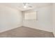 Cozy bedroom featuring soft carpet, neutral walls, and a window with blinds at 8501 E Malcomb Dr, Scottsdale, AZ 85250