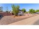 Charming home with desert landscaping and a privacy wall at 8501 E Malcomb Dr, Scottsdale, AZ 85250