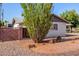 Charming home with desert landscaping and a privacy wall at 8501 E Malcomb Dr, Scottsdale, AZ 85250