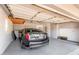 Spacious garage featuring ample storage cabinets, painted floors, and room for vehicle and more at 8501 E Malcomb Dr, Scottsdale, AZ 85250