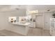 Bright, clean kitchen featuring white cabinetry, tile flooring, and modern appliances at 8501 E Malcomb Dr, Scottsdale, AZ 85250