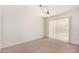 Bright Living room with vertical blinds, neutral carpet, and bright overhead lighting at 8501 E Malcomb Dr, Scottsdale, AZ 85250