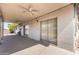 Covered patio with ceiling fans, perfect for outdoor relaxation and entertaining with backyard views at 8501 E Malcomb Dr, Scottsdale, AZ 85250