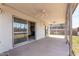 Covered patio featuring ceiling fans, seamlessly connecting indoor living with outdoor spaces at 8501 E Malcomb Dr, Scottsdale, AZ 85250