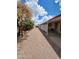 A gravel path leads down the side of the house and opens to the backyard at 901 S Esperanza Ave, Mesa, AZ 85208