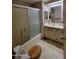 The bathroom features a shower over tub, toilet and vanity at 901 S Esperanza Ave, Mesa, AZ 85208