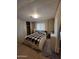 This bedroom has a queen bed, carpet floors and beige walls at 901 S Esperanza Ave, Mesa, AZ 85208