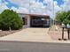 Single-story home with a covered carport and desert landscaping at 901 S Esperanza Ave, Mesa, AZ 85208