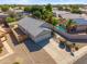 An aerial view of a single-Gathering home with a pool, a well-maintained yard, and a gray tile roof at 9422 W Monroe St, Peoria, AZ 85345