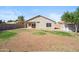 Backyard showing an open space, privacy fence, and desert-friendly landscaping at 9422 W Monroe St, Peoria, AZ 85345