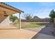 Enjoy the covered patio, lush landscaping, and plenty of space in this beautiful backyard at 9422 W Monroe St, Peoria, AZ 85345