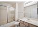 Bright bathroom with shower over tub and modern vanity at 9422 W Monroe St, Peoria, AZ 85345
