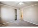 Bedroom featuring neutral colored walls, carpet, ceiling fan and closet at 9422 W Monroe St, Peoria, AZ 85345