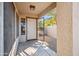Welcoming front porch with a security screen door that leads into the home at 9422 W Monroe St, Peoria, AZ 85345