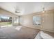 Spacious living room with access to the backyard through sliding glass doors, perfect for indoor/outdoor living at 9422 W Monroe St, Peoria, AZ 85345